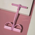 Yoga four piece fitness set showing leg stretcher, foot pedal, yoga ring, and figure eight tension rope.