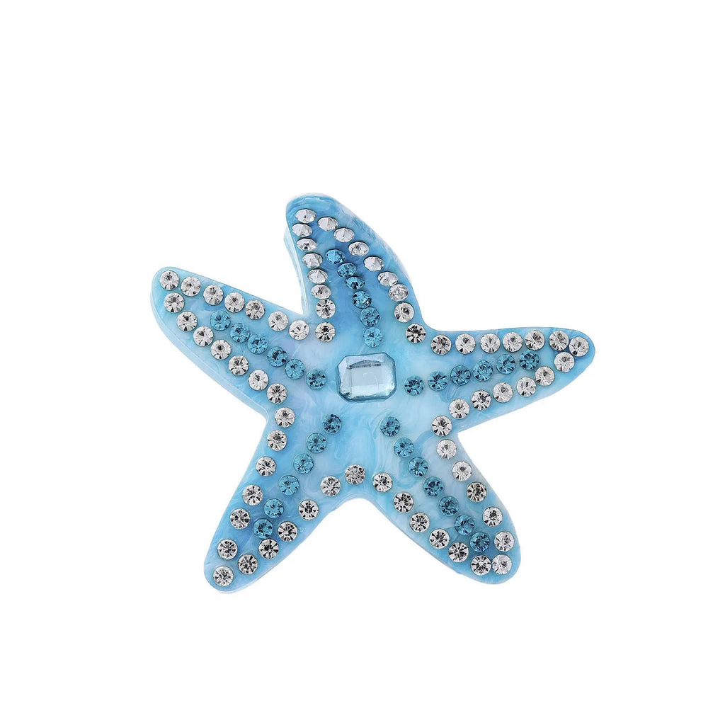 Blue acrylic starfish hairpin with diamond-encrusted surface on white background