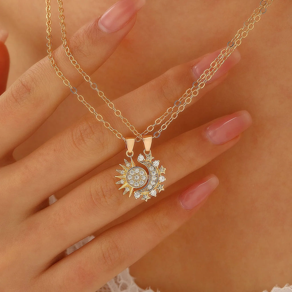 Two copper sun and moon magnetic pendant necklaces on a white background, clavicle chain length, set for couples
