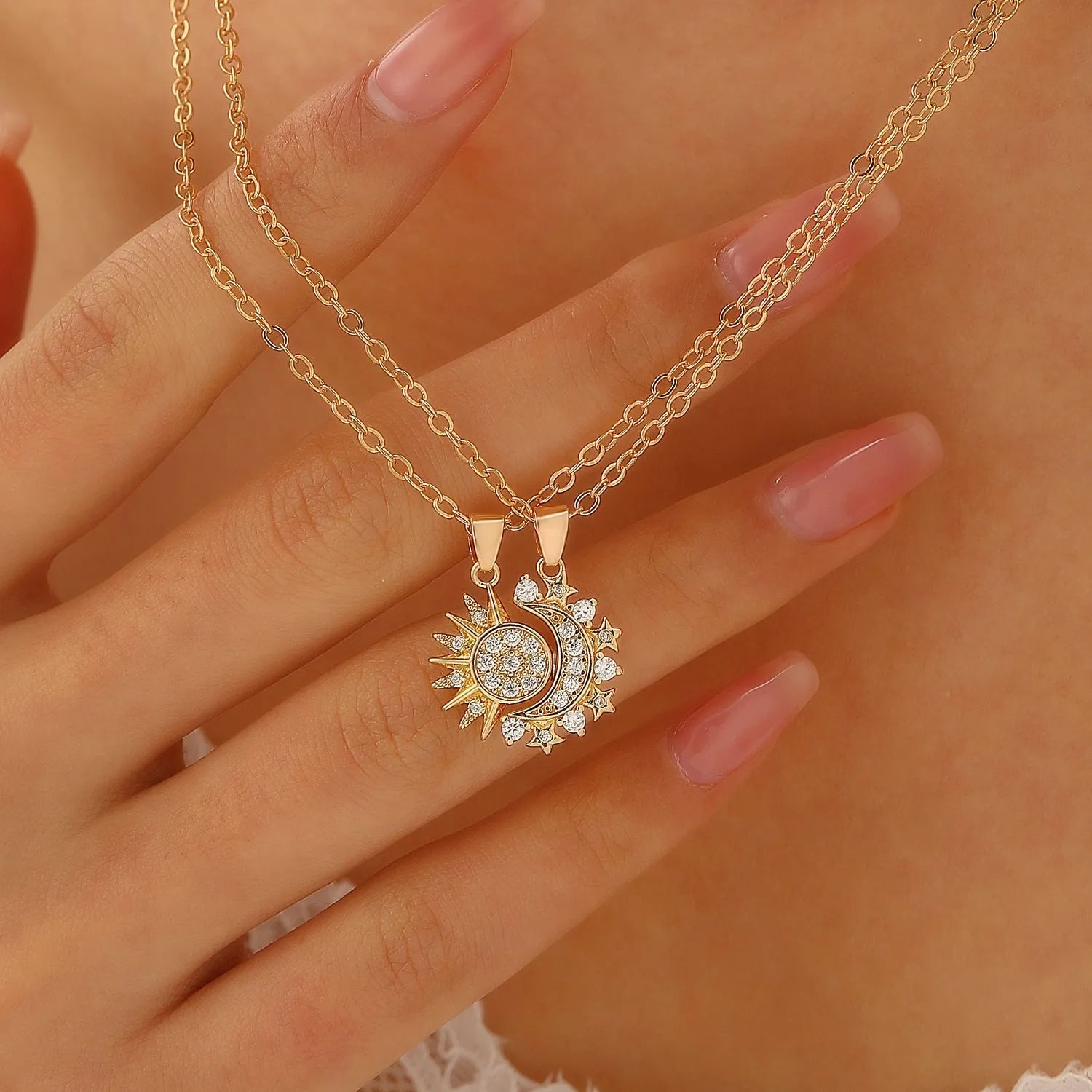 Two copper sun and moon magnetic pendant necklaces on a white background, clavicle chain length, set for couples