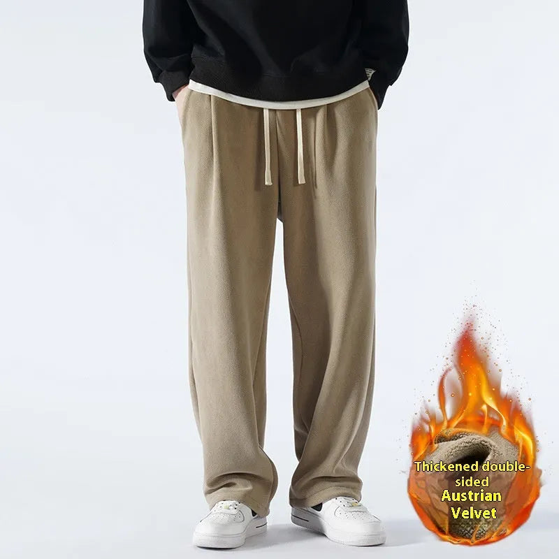 Man wearing apricot coloured loose-fit fleece-lined casual trousers with an elasticated waist.