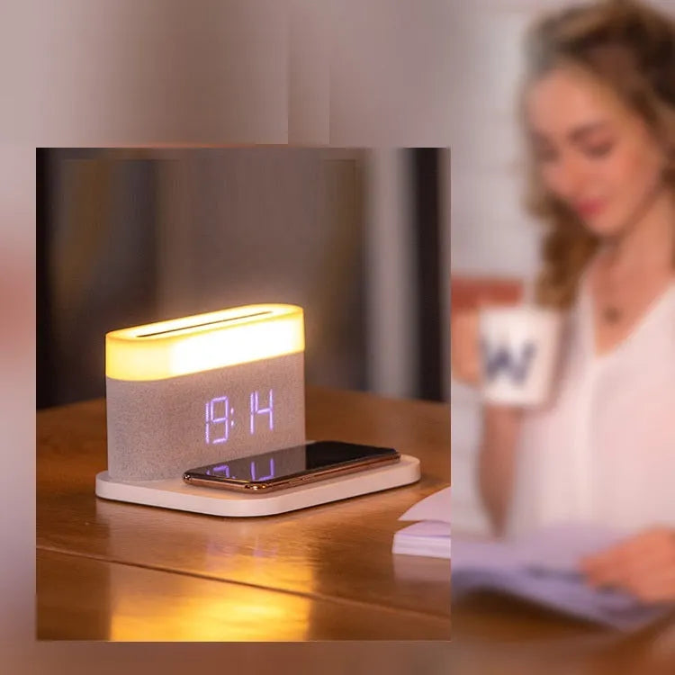 White bedside table lamp with integrated wireless phone charger and clock display