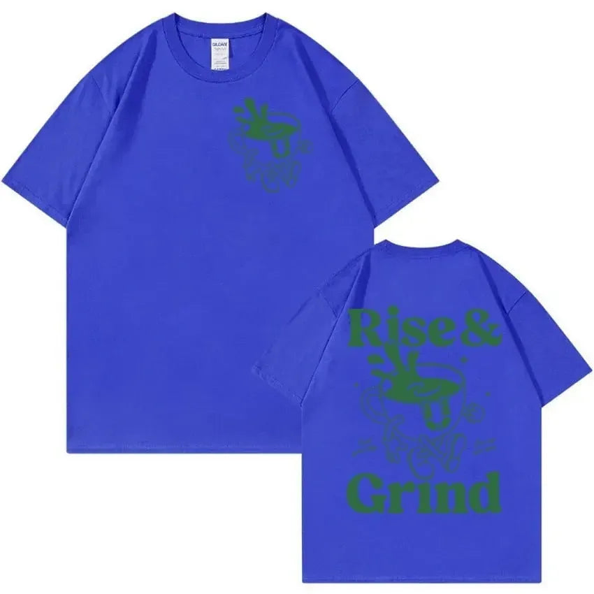 A loose-fit linen T-shirt with a Rise And Grind Green Coffee cartoon print, shown in one of ten available colours.