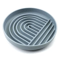 Beige silicone slow feeder bowl for dogs with textured ridges to reduce gulping