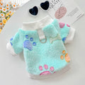 Blue paw print cotton flannel pet coat for dogs and cats, size medium, laid flat