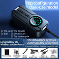 Black portable wireless air pump with digital display, battery, and nozzle accessories on a grey background.