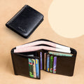 Men's black leather bi-fold wallet open to show card slots, banknote compartment, and coin pocket.