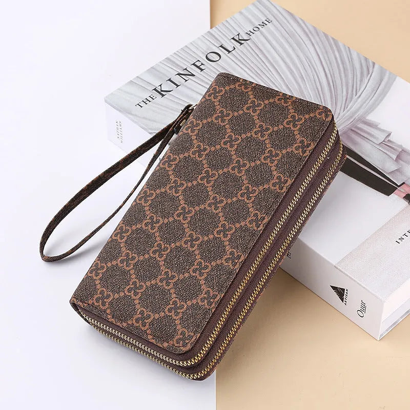 Long black PU leather wallet clutch with retro styling, open to show mobile phone compartment and coin purse sections