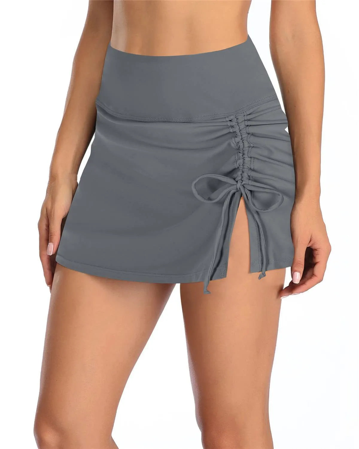 Women's solid colour briefs-style swimming trunks in polyester fabric