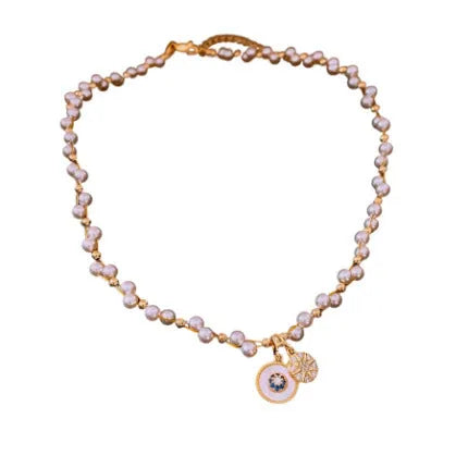 Gold electroplated zircon and imitation pearl pendant necklace on adjustable clavicle chain