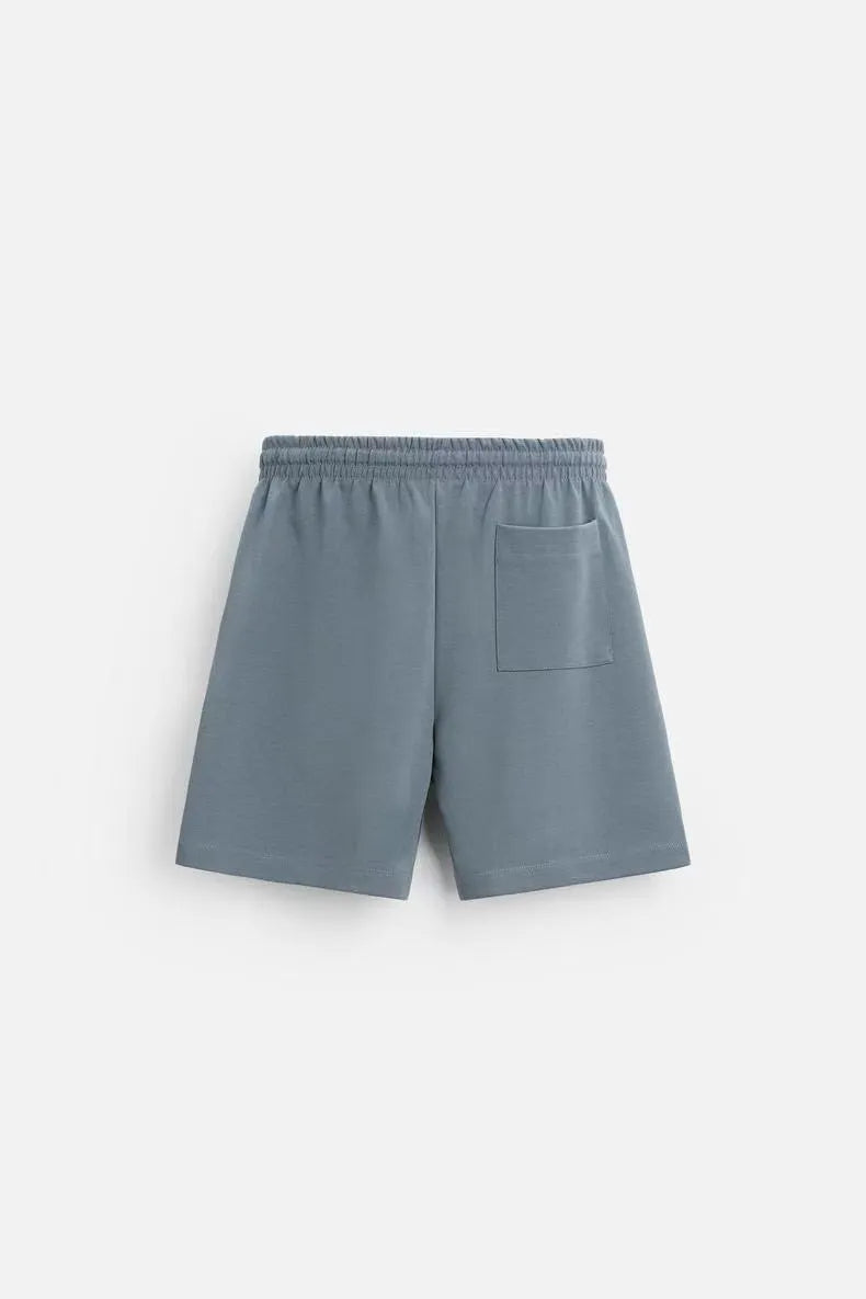 Loose double-sided cloth texture short sleeve top and matching shorts set on a hanger.