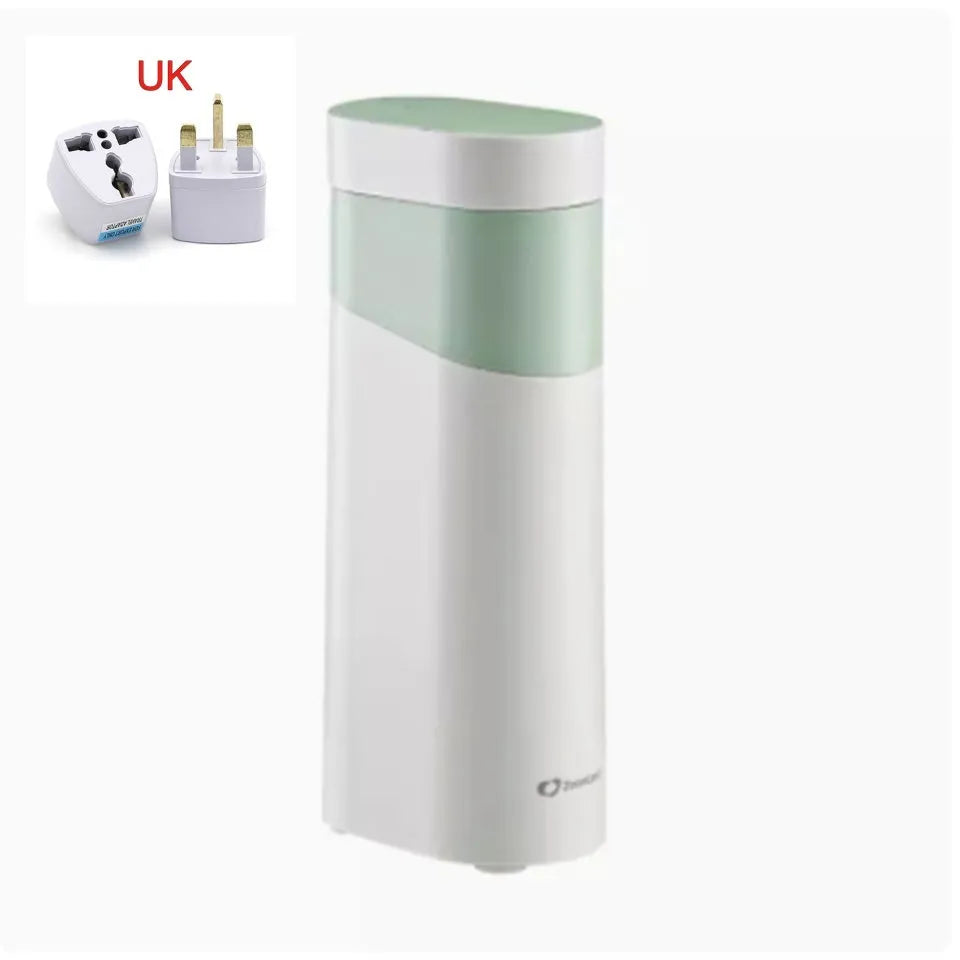 Black portable instant water dispenser with digital display on a wooden desktop.