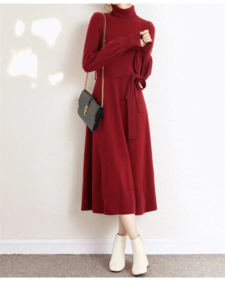Rose red turtleneck knit dress with long sleeves, elastic waist, and loose mid-length sweater skirt hem.