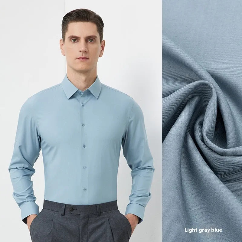 Man wearing a light blue long-sleeved non-iron business casual shirt with a regular fit.