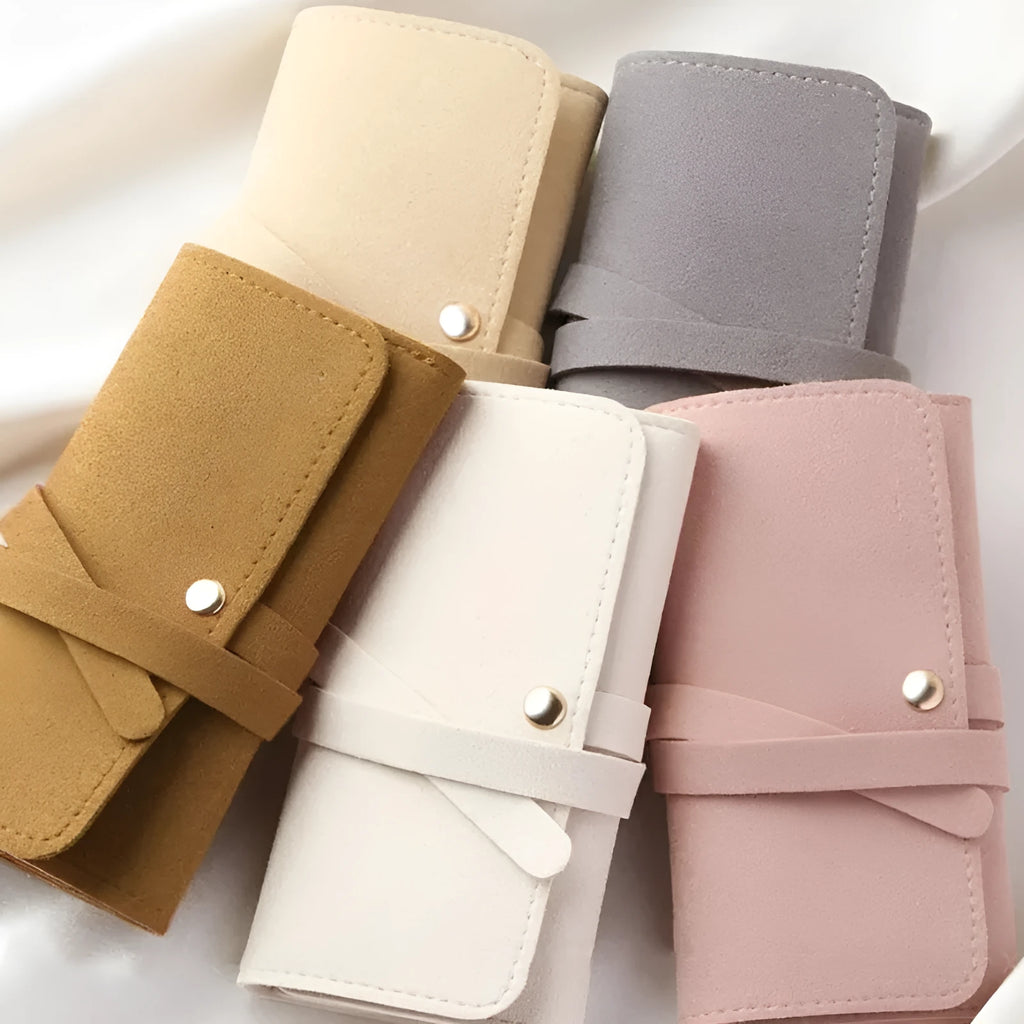 Brown soft leather and microfiber jewellery storage pouch measuring 12 by 12 centimetres.