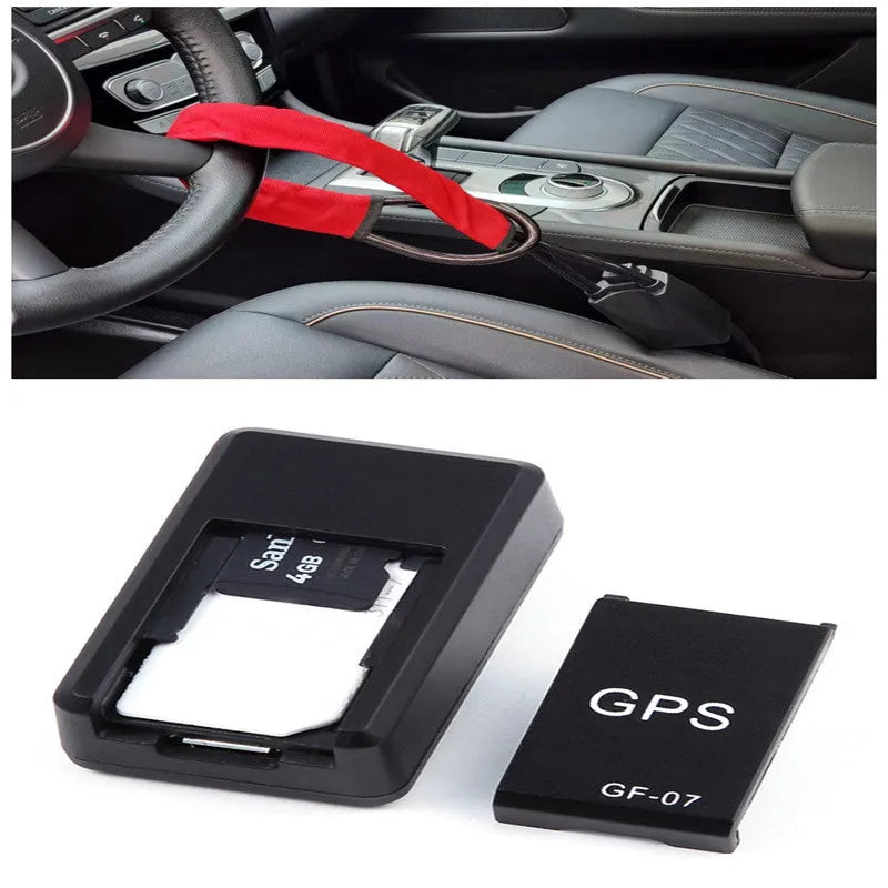 Small black plastic magnetic GPS tracker device next to a USB charging cable.
