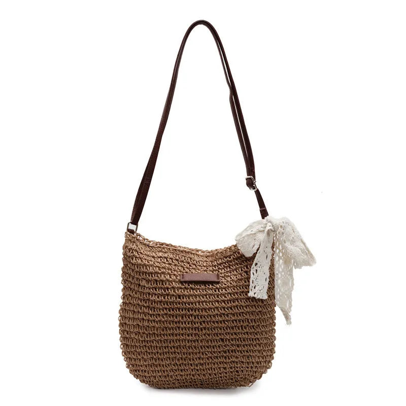 Women's woven straw messenger bag with hollowed design and single shoulder strap in khaki colour
