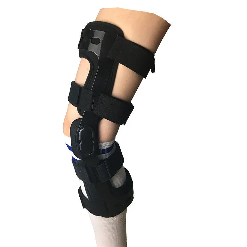 Black anterior ligament knee pad with iron stabilisers showing multi-layer construction