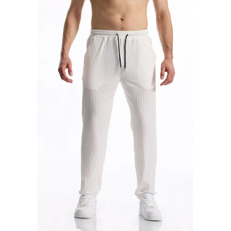 Men's black silky rib fabric casual trousers with baggy straight leg and elastic waistband
