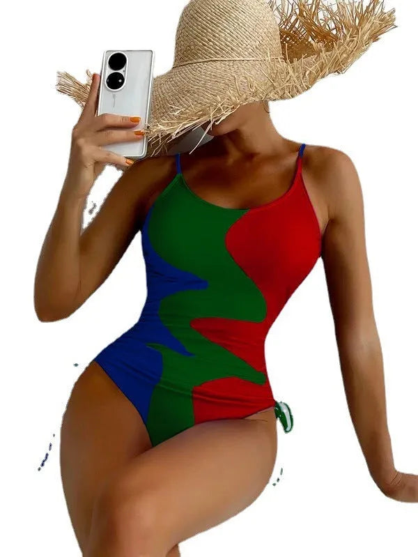 Women's blue sleeveless backless one-piece swimsuit with striped pattern on a mannequin