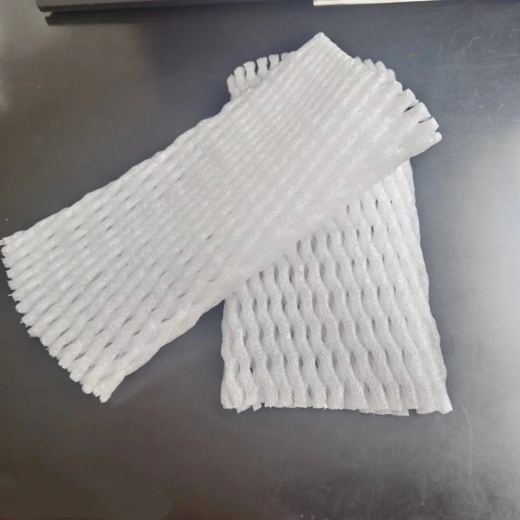 White foam protective net cover for apples, pears, peaches and oranges.