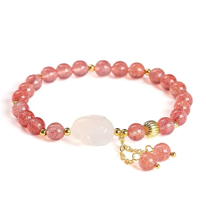 Handmade women's bracelet with natural strawberry quartz and agate 6mm round beads on a wrist.
