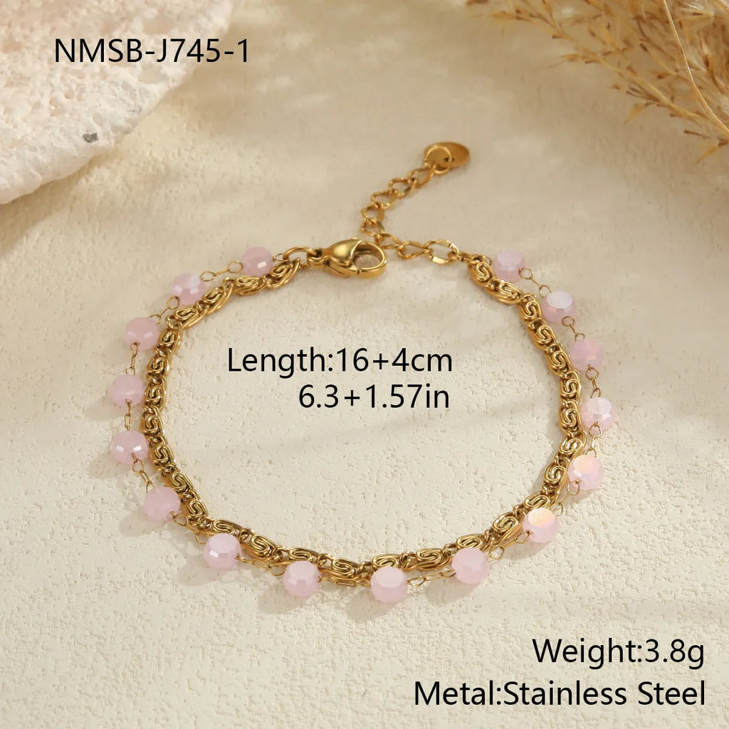 Colourful beaded stainless steel necklace with gold-plated double layer clavicle chain on display