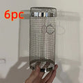 Rolling grill basket iron wire mesh 20x10x10cm with hook, filled with vegetables on a barbecue