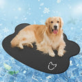 Dog head shaped ice silk cooling mat for pets in grey, green or rice colours on a wooden floor