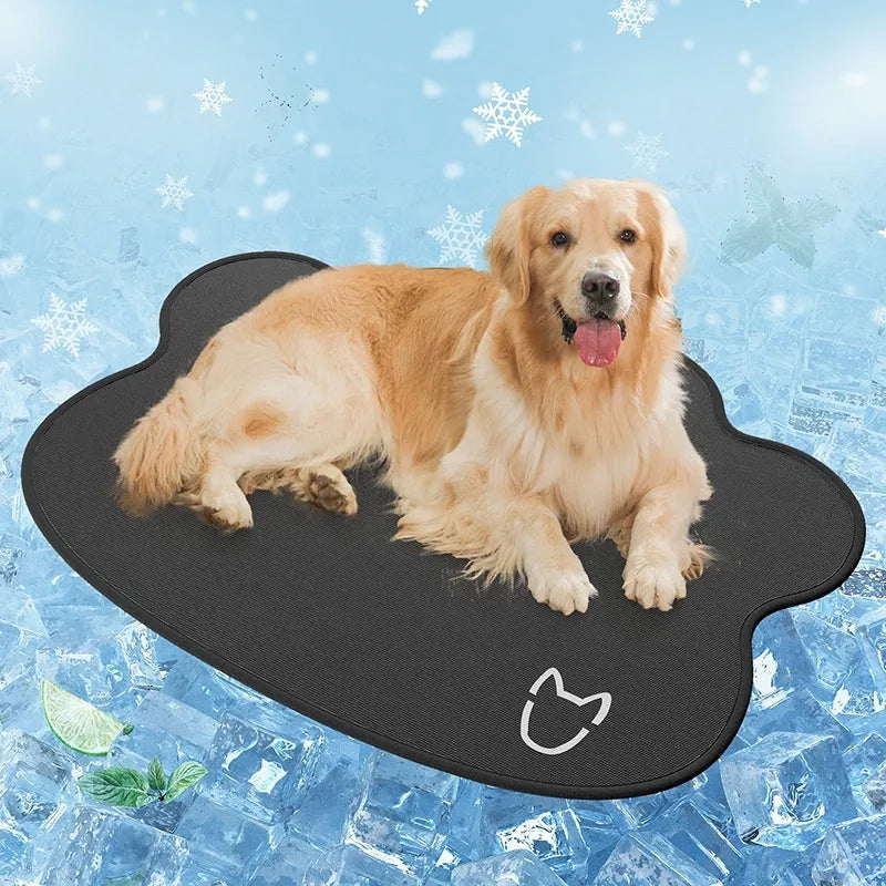 Dog head shaped ice silk cooling mat for pets in grey, green or rice colours on a wooden floor