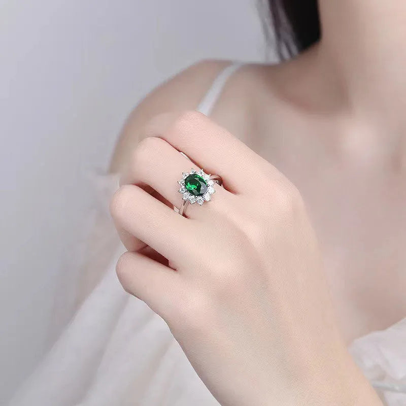 Blue moissanite stone set in a copper flower-shaped ring available in green, red, or blue.