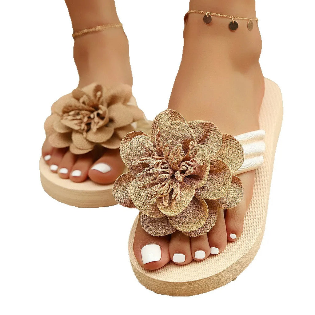 Women's solid colour PU flower flip-flops on a flat surface, showing the strap with decorative flower detail