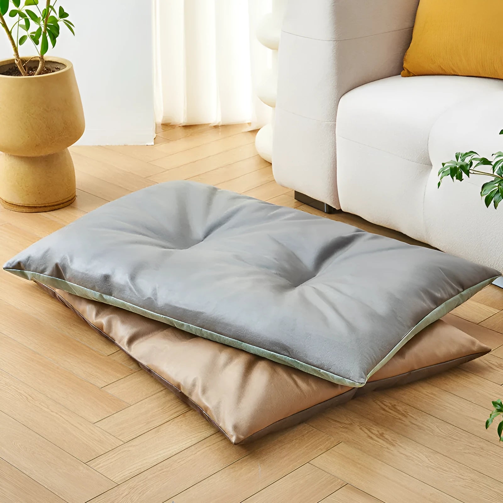 Blue plush fabric pet sleeping mat for cats or small dogs shown in a home setting.