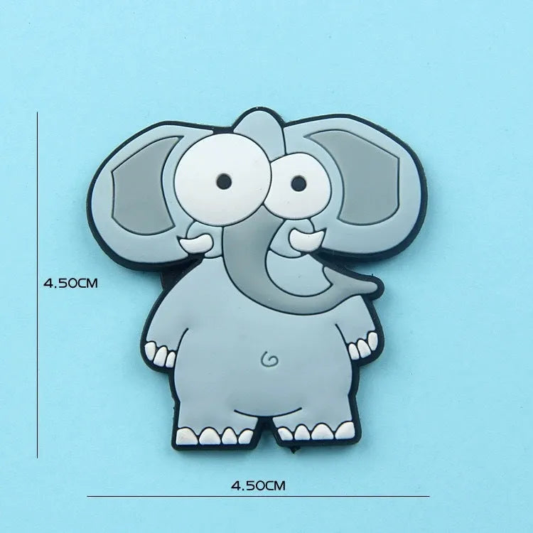 Set of 9 colourful PVC cartoon animal refrigerator stickers on a white fridge surface