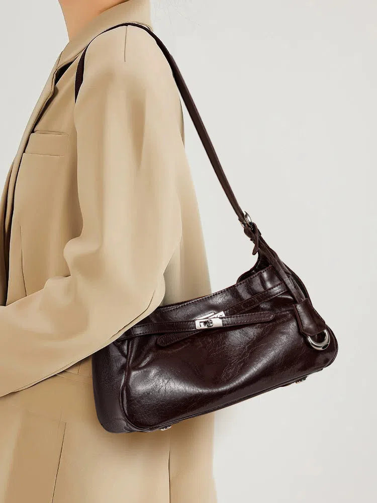 Genuine leather horizontal square crossbody bag with stitching and inner zippered compartment in brown