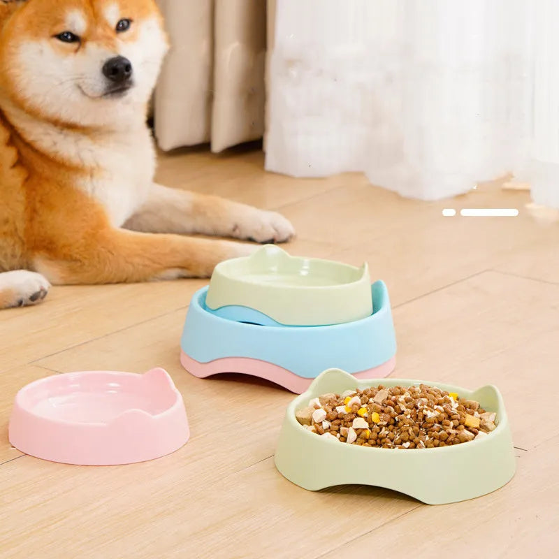 Ceramic dog slow feeder bowl with puzzle maze design in blue, green and pink colours showing S and L size options