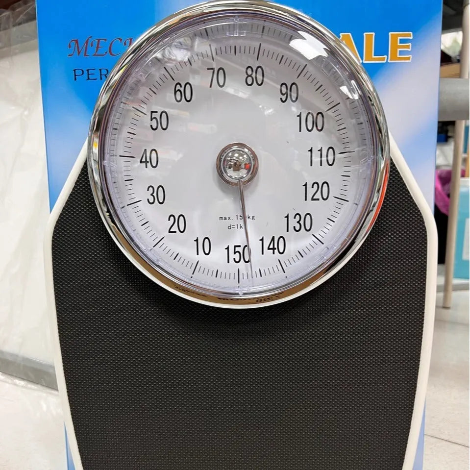 Large dial mechanical pointer body weight scale in black, 47x35x11cm, on bathroom floor