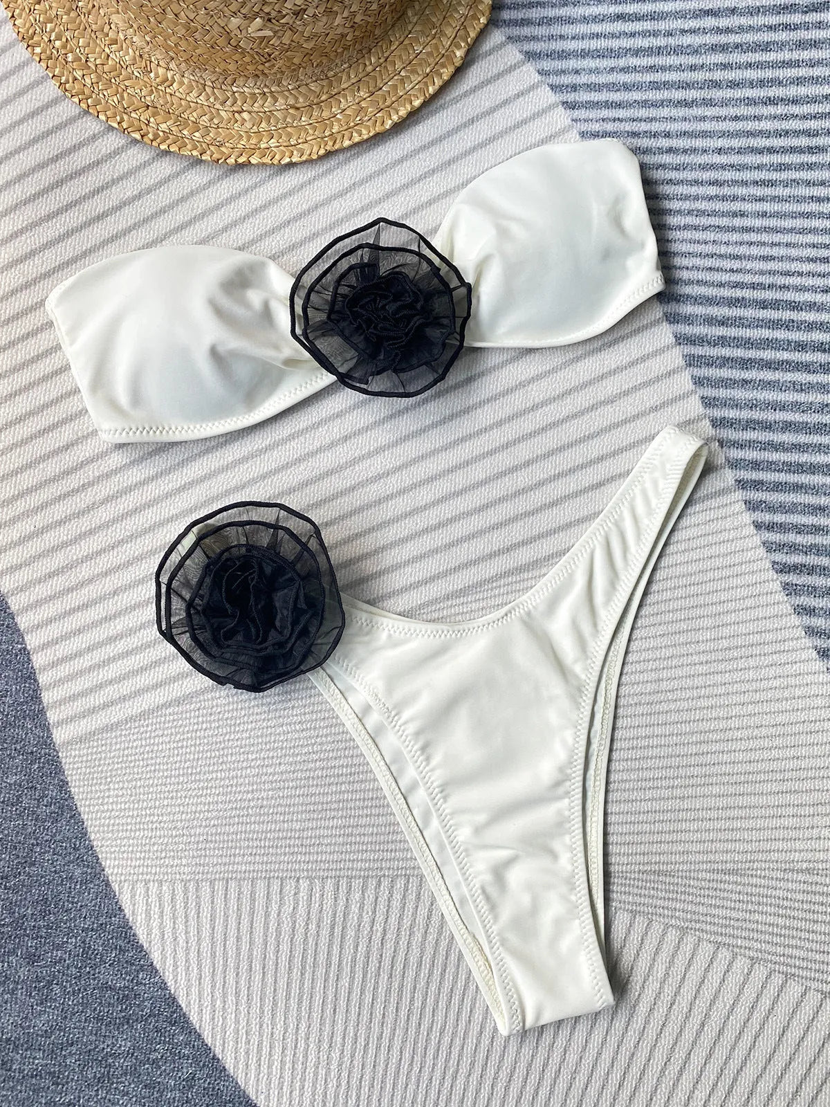 Women's striped tube top bikini with three-dimensional floral split detail on the shorts.