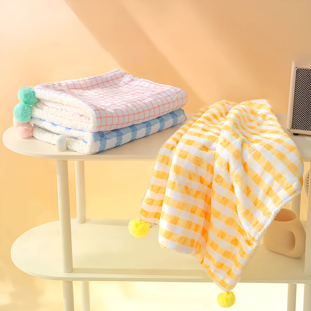 Blue coral fleece pet blanket shown laid out flat, demonstrating its soft texture and size.