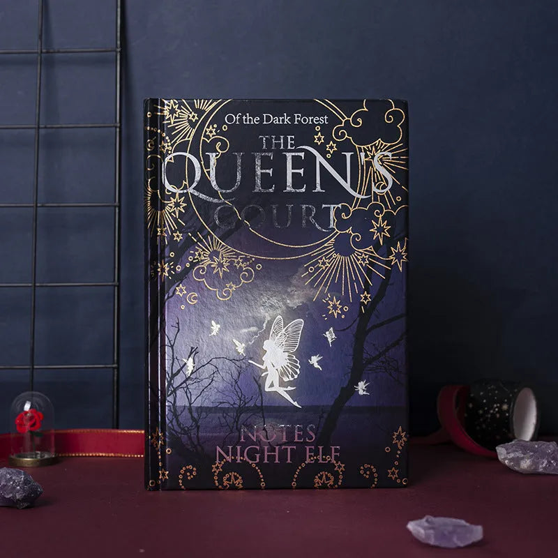 Blue A5 notebook with luminous hardcover showing night elves illustration, open to reveal full-colour printed pages