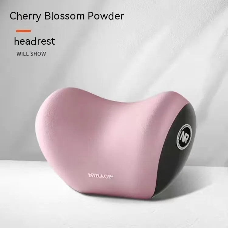 Black memory foam car lumbar support pillow and matching headrest pillow on a car seat.