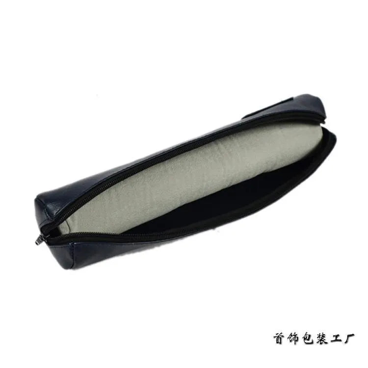 Portable bracelet watch storage bag in black leather with black bracelet stick on a flat surface