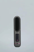 Portable charging negative ion straight hair comb in white, dark blue, and gray on a neutral background
