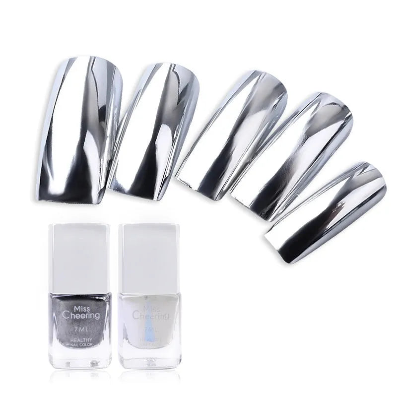 Bottle of mirror silver nail polish with brush and stainless-steel ball for mixing