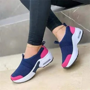 Women's lightweight mesh sneaker in multiple colours showing round toe and rubber sole.