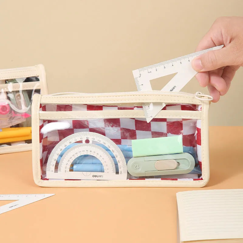 Transparent PVC pencil case with a chessboard grid pattern, showing pens inside.