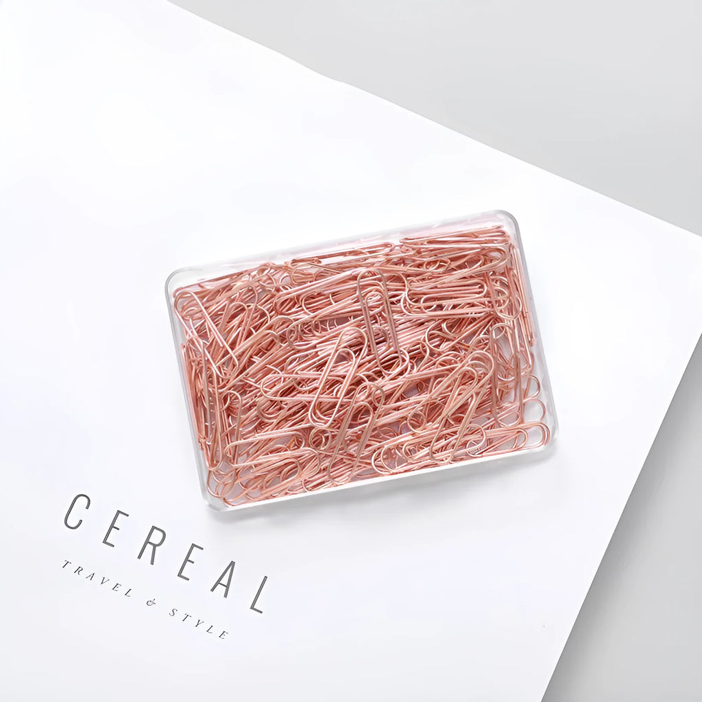 Rose gold coloured metal heart-shaped paper clips, size 28mm, in a box of 100 pieces.