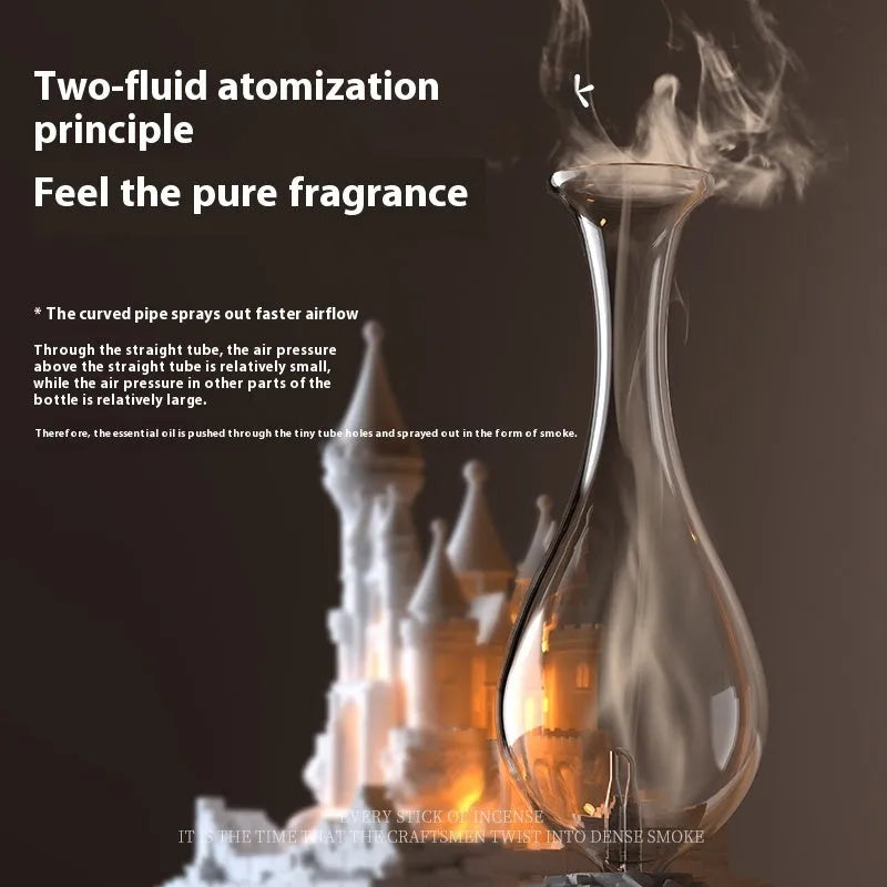 White medieval castle waterless aromatherapy machine with ambient light on a desk.