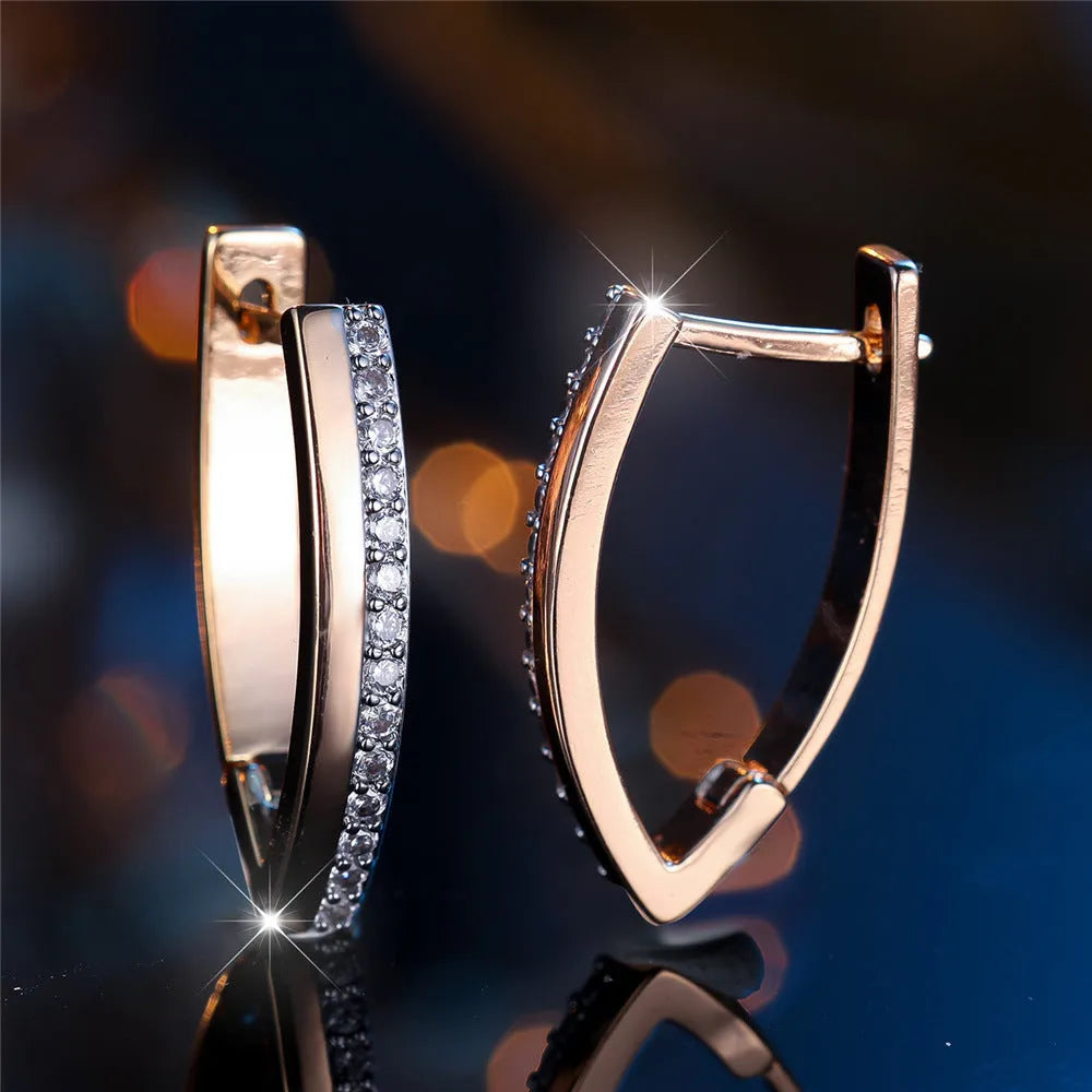 Women's V-shaped electroplated copper ear clips in Champagne Gold and White Diamond geometric design