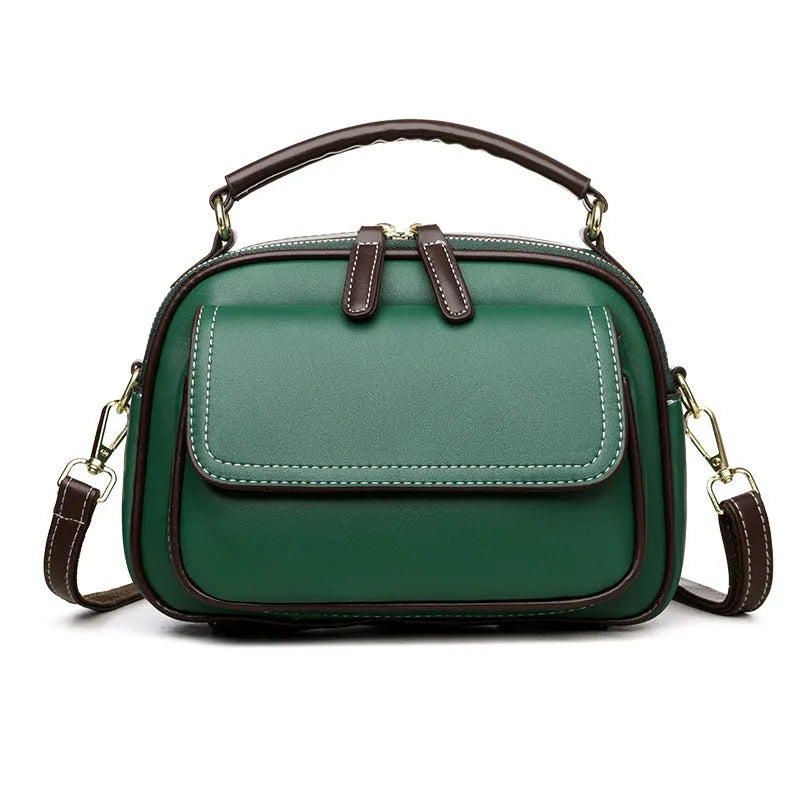 Black women's cross-body PU shoulder bag with adjustable straps showing its square shape and size.